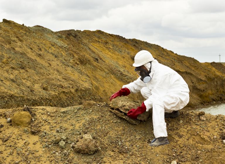 technician testing hazardous waste