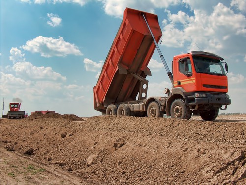Tipper truck dumping aggregate