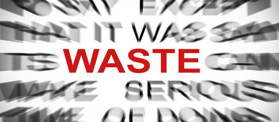Image of the word Waste in red with text around blurred to only show off 'waste'
